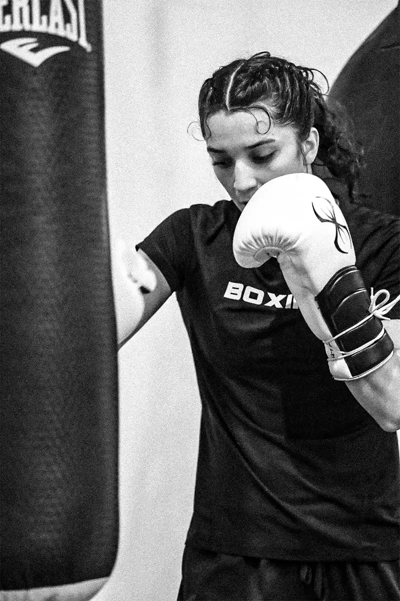 Alyssa Mendoza hits a punching bag as she trains for a big fight.