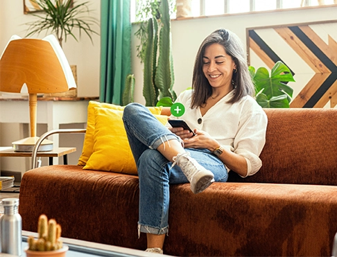 A woman holding a phone with a visual of a plus sign for Central Plus Checking