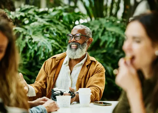 A happy man who is about the age of receiving Social Security benefits