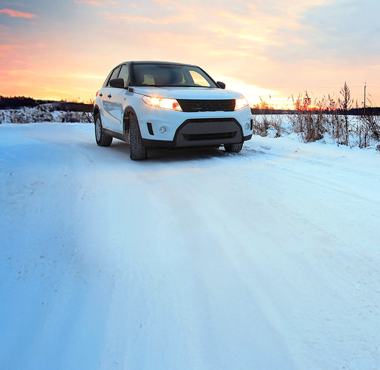 A car driving on snowy roads