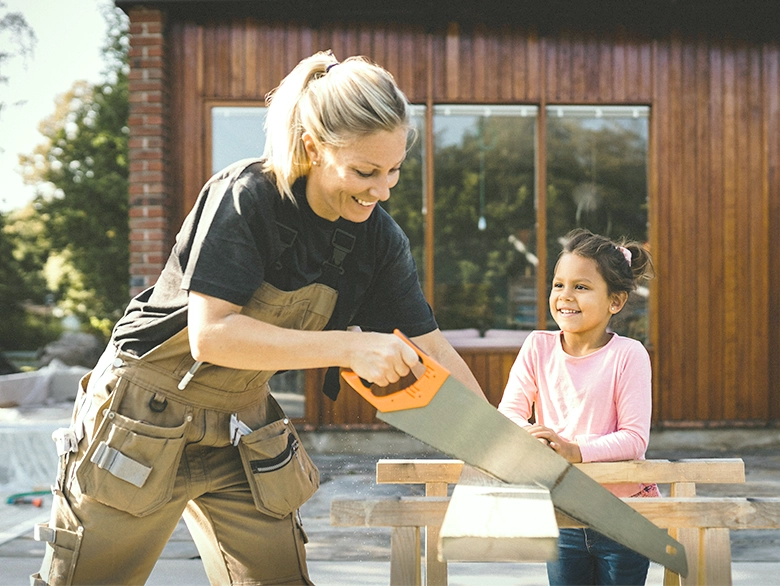 A child watching her mother work on home renovations